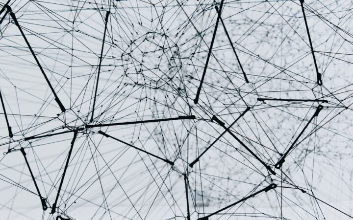 Multi-agent orchestration concept: a network of specialised AI agents coordinating as planner, executor and validator in an enterprise system