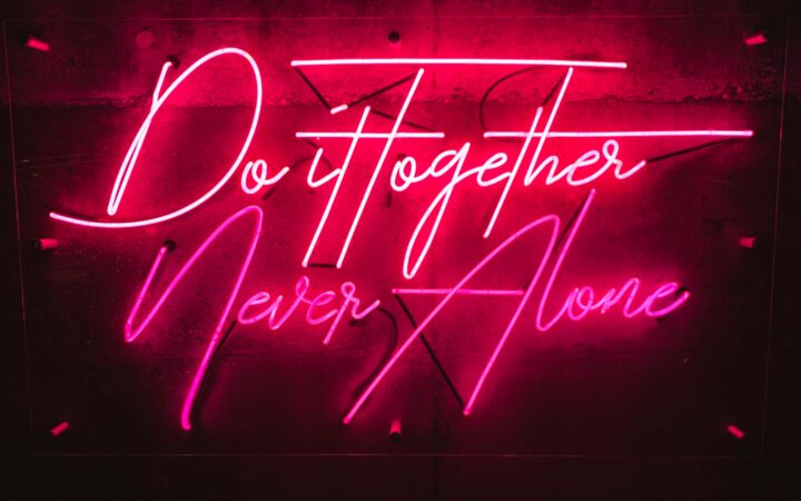 Naming an AI company: choosing a distinctive brand name that stands out, represented by an illuminated neon sign