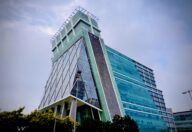 RBI FREE-AI framework for responsible AI in Indian financial services, represented by a corporate finance district in India
